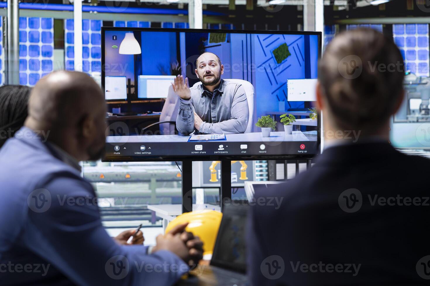 Investors reading solar panels factory paperwork, reviewing financial statements during online videocall. Photovoltaics plant shareholders in remote videoconference looking at compliance records photo