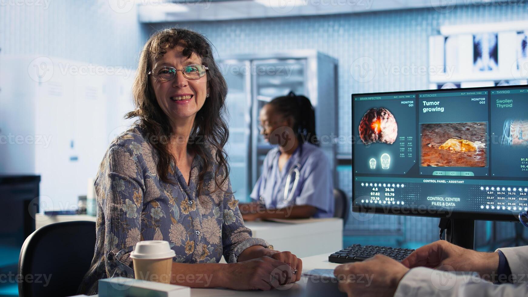Senior healthcare medic sharing expertise and interpreting MRI scans results, offering advice and support to sick woman at checkup. Accurate diagnostics and patient care. Camera A. photo