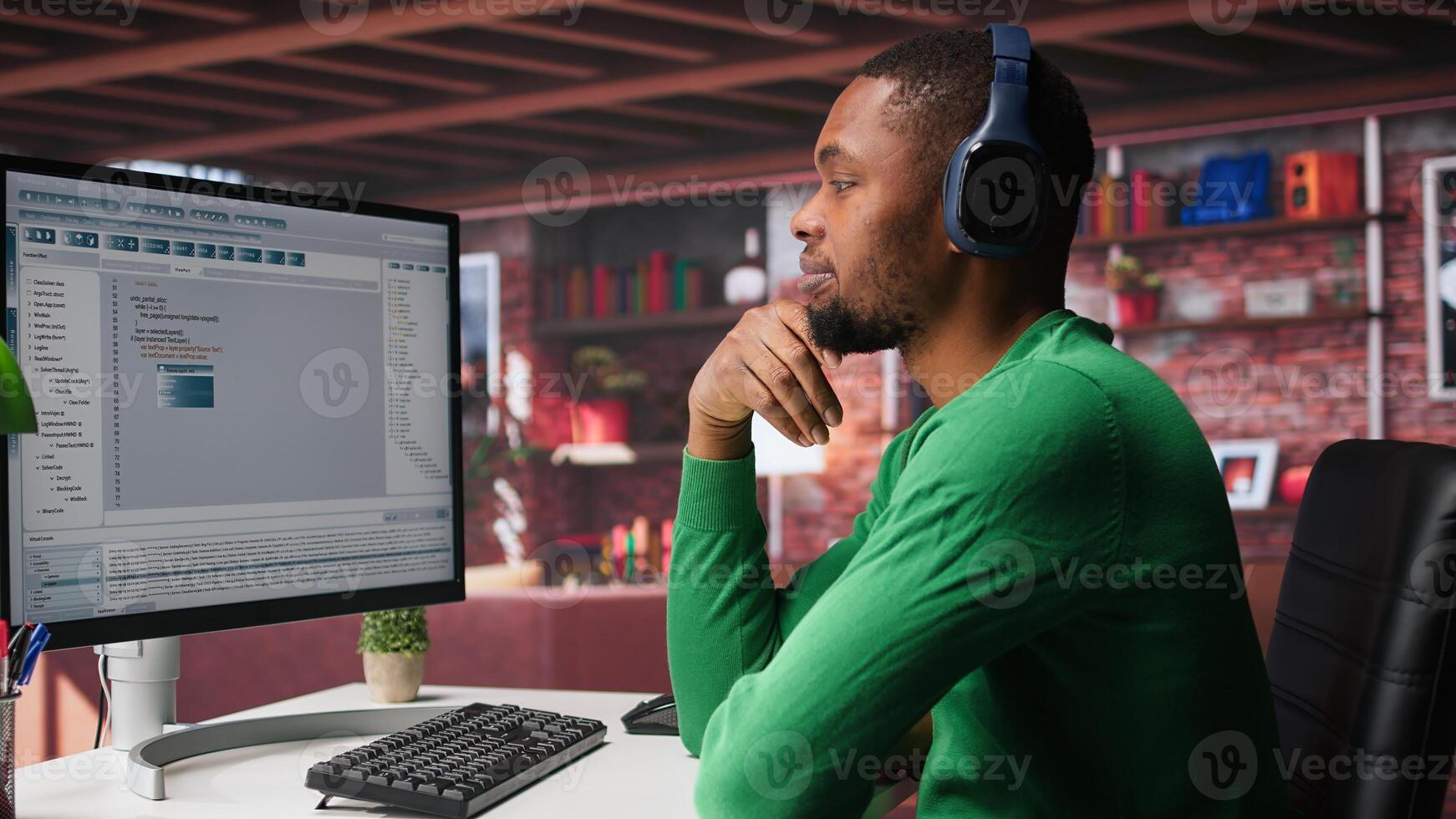 Freelance developer writing code in modern programming language. Young man analyzes data, algorithms and optimizing performance while using binary code at home office. Camera B. photo