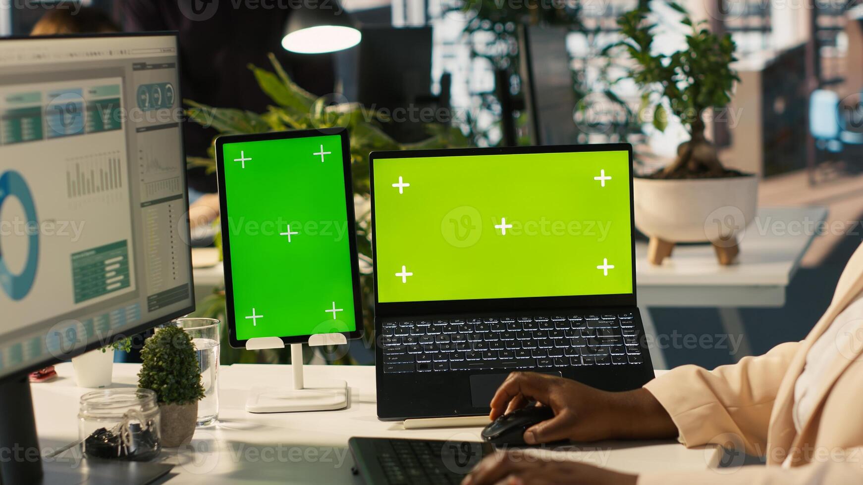Mockup tablet and laptop in office used by employee working on company administrative tasks. Chroma key devices on desk used by worker reviewing business metrics, camera A photo
