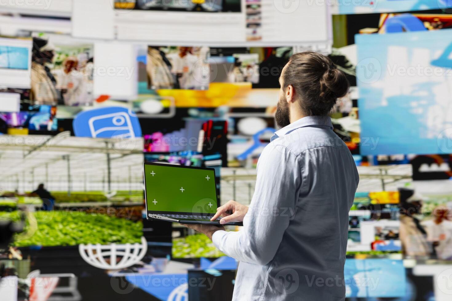 Social media manager uses device with isolated display for online presence, using his imagination and storytelling skills to connect with followers and boost online engagement. Modern web design. photo