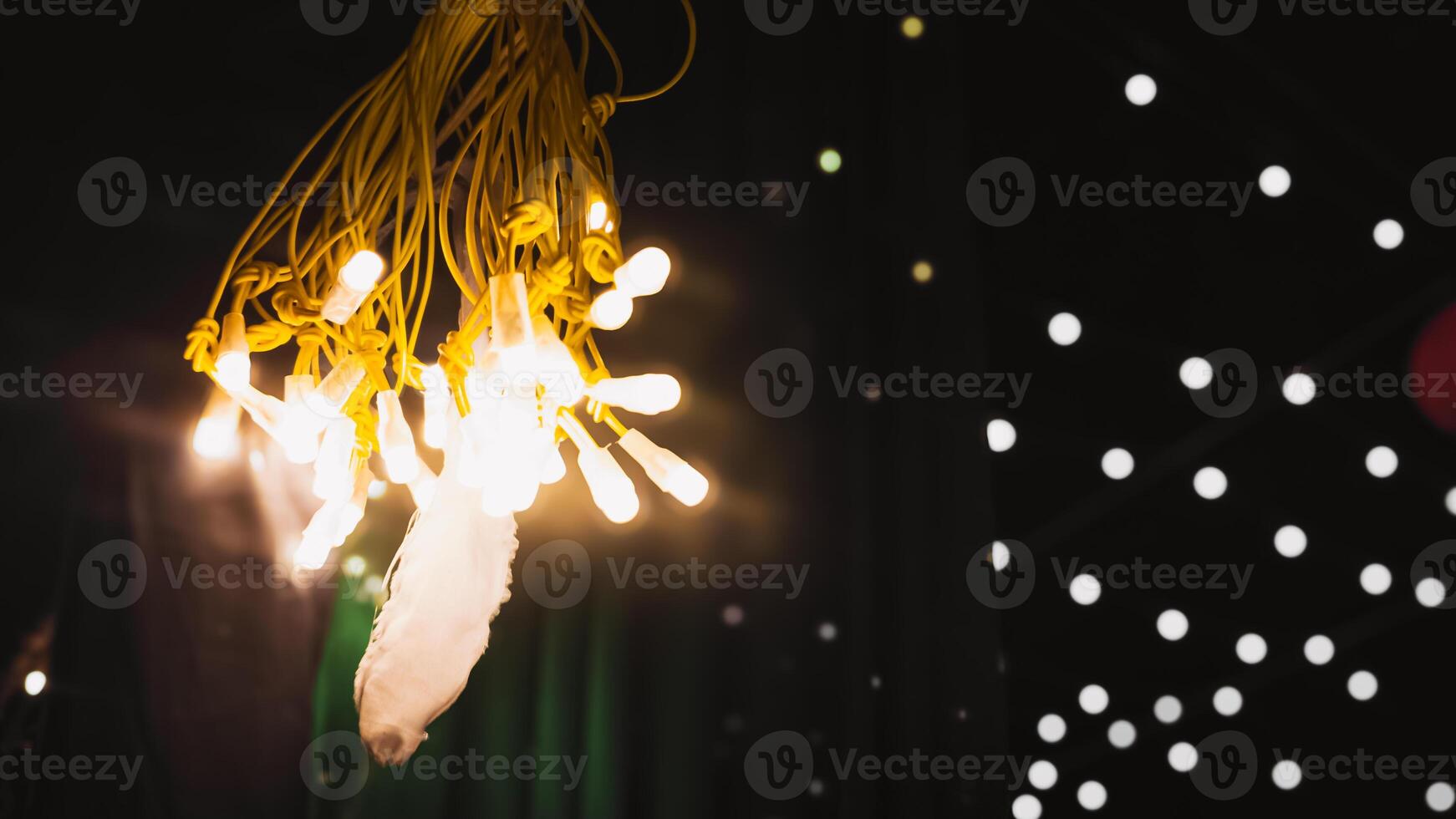 Yellow String Lights with Warm Glow, Festive Nighttime Illumination photo