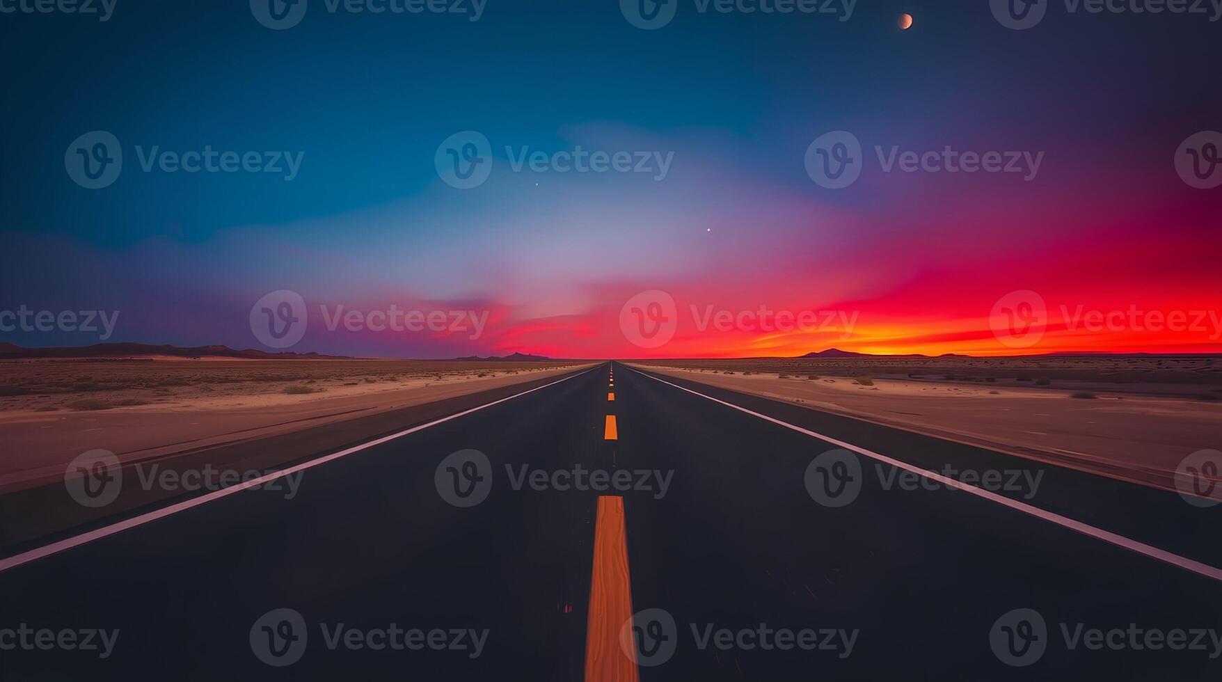 An empty road with a sunset in the background photo