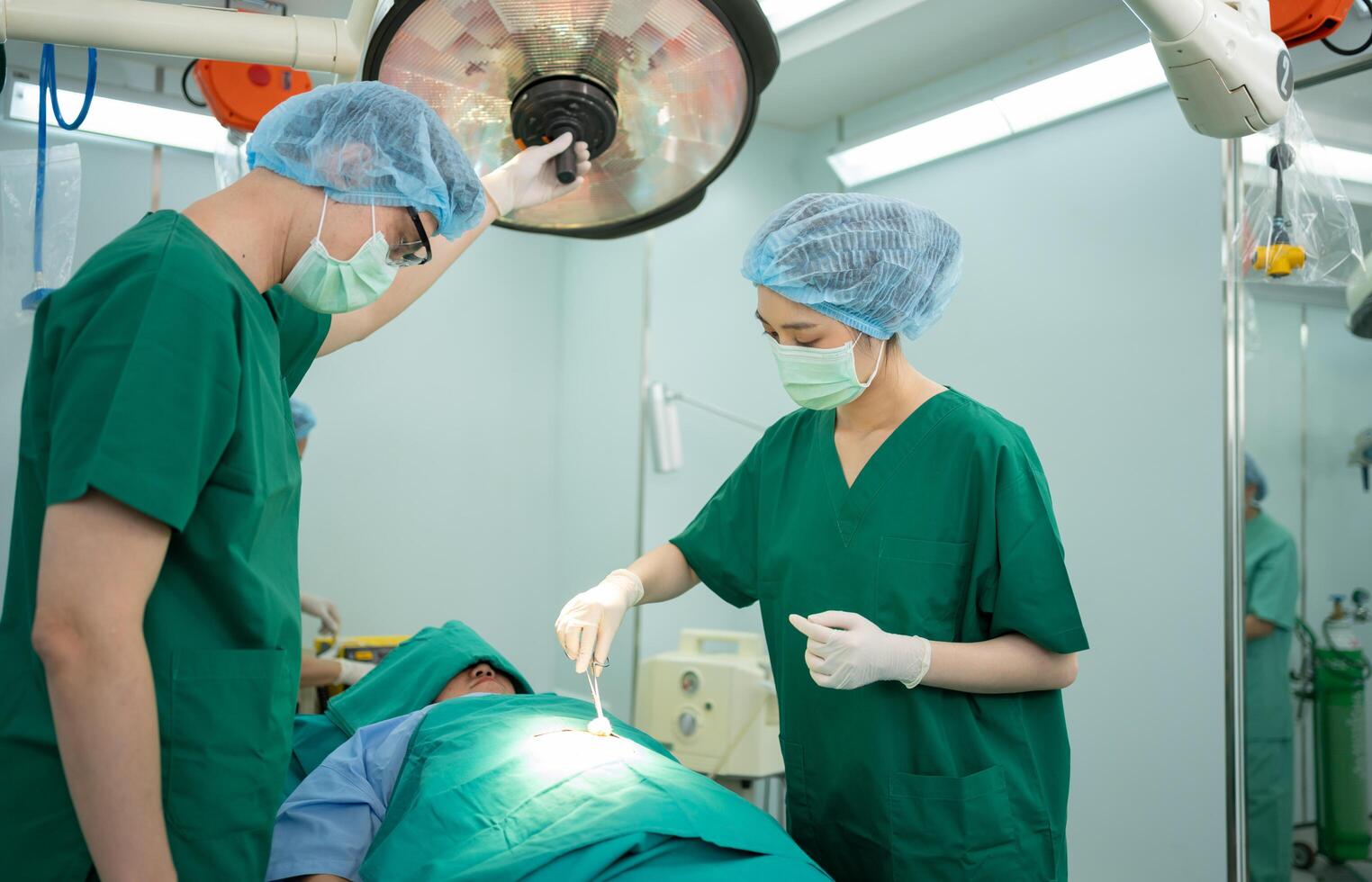 Asian Professional surgeons team performing surgery in the operating room, surgeon, Assistants, and Nurses Performing Surgery on a Patient, health care cancer and disease treatment photo