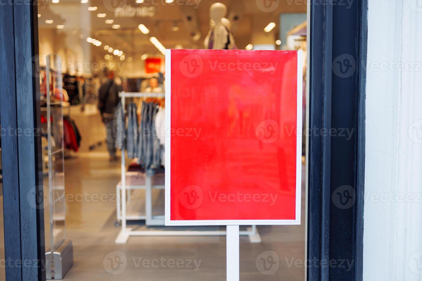 Sign indicating closure retail store during business hours in an urban shopping area photo