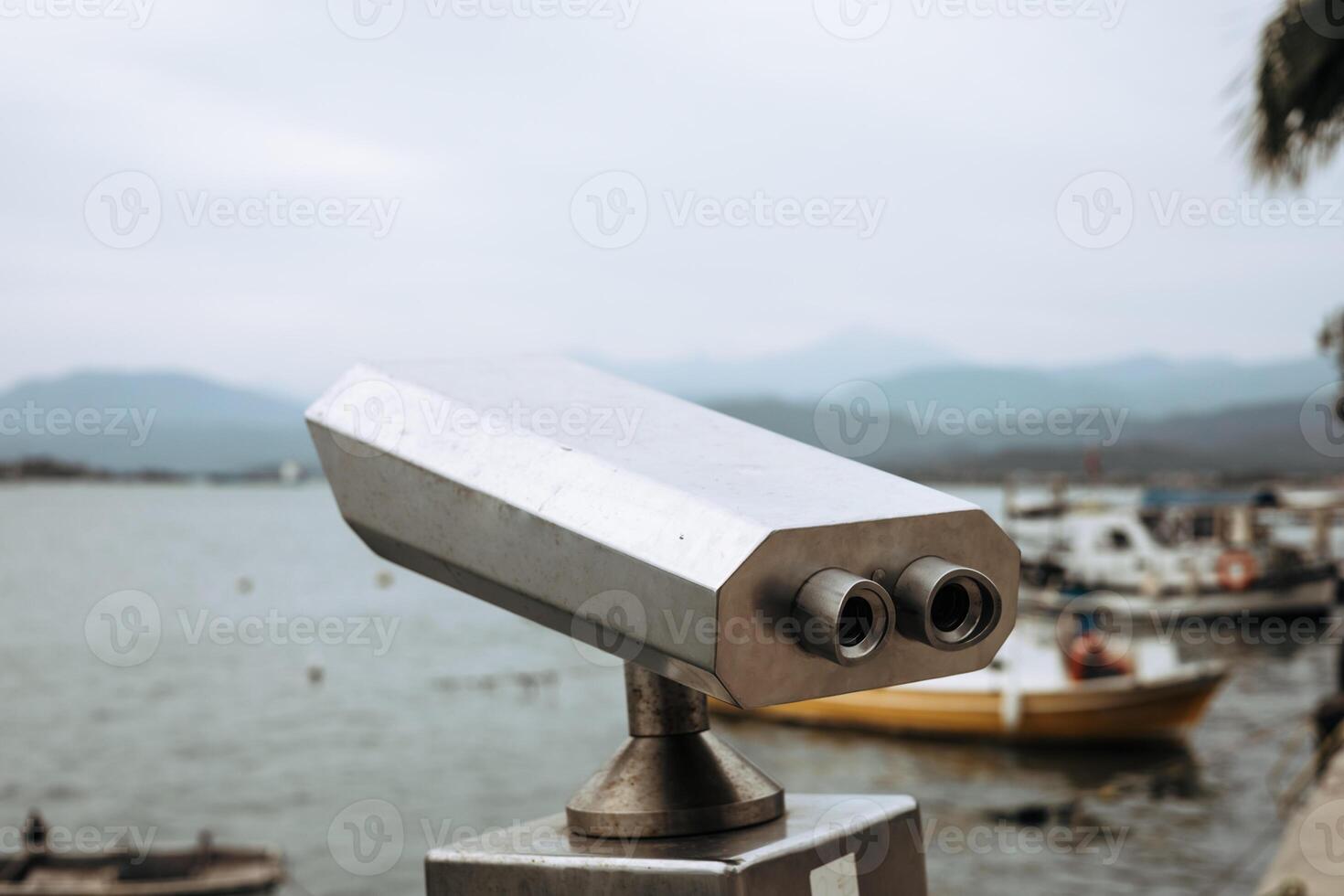 Views from a coastal lookout near water with boat in the distance. photo
