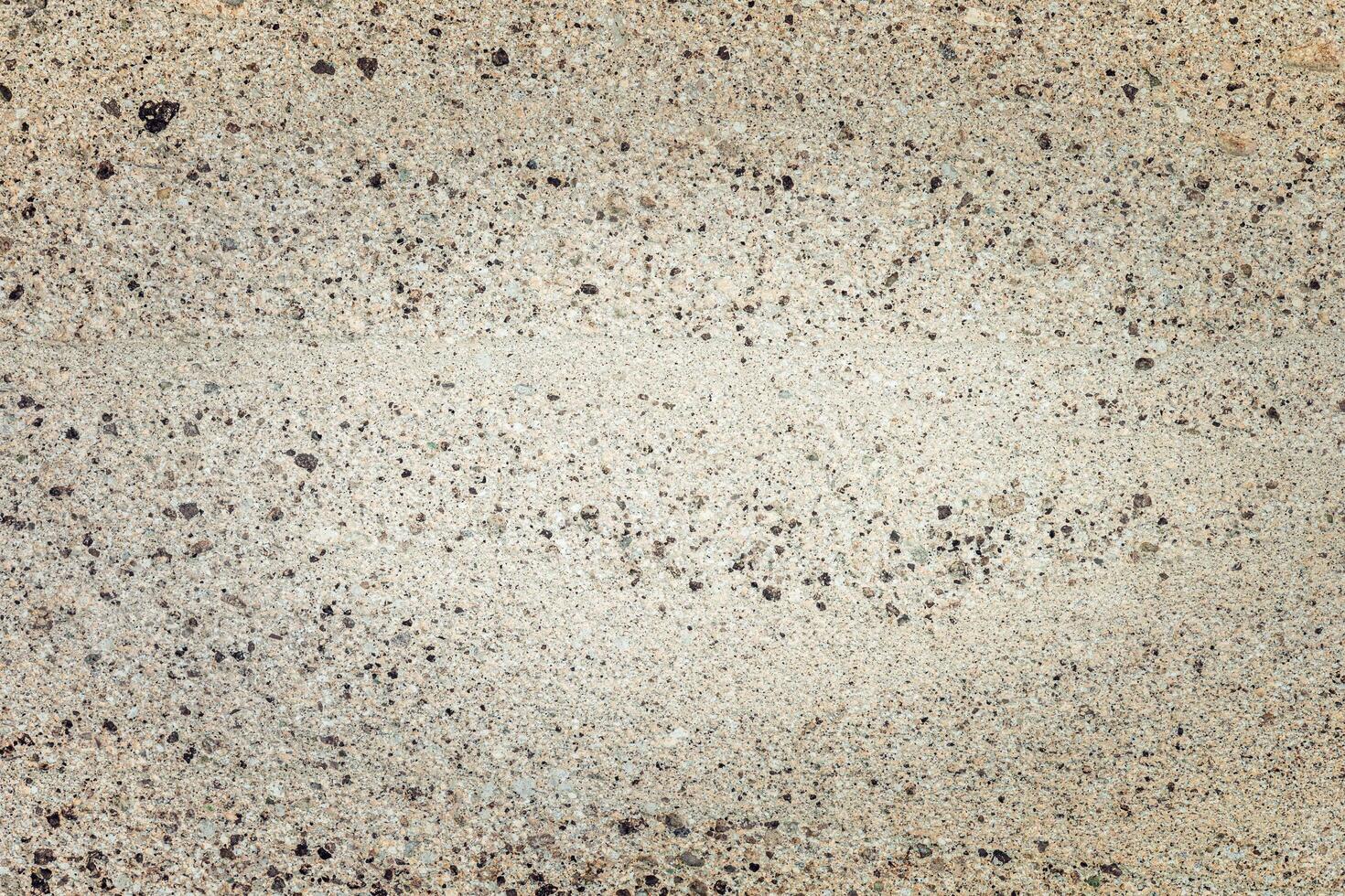 Textured background featuring a unique blend of colors and patterns on a concrete surface. photo
