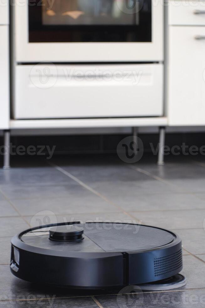 Robot vacuum cleaner with dust, real life photo, saves time and goes into hard-to-reach places, electronic photo