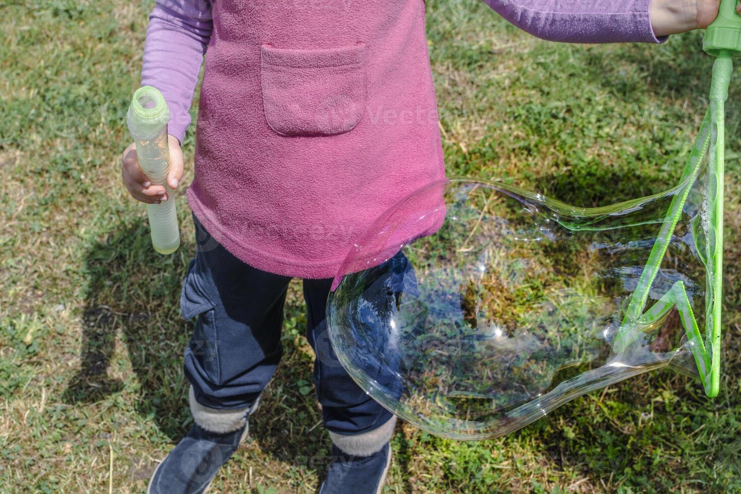 Soap bubble, outdoors activity and leisure for happy kid, real life photo, game photo