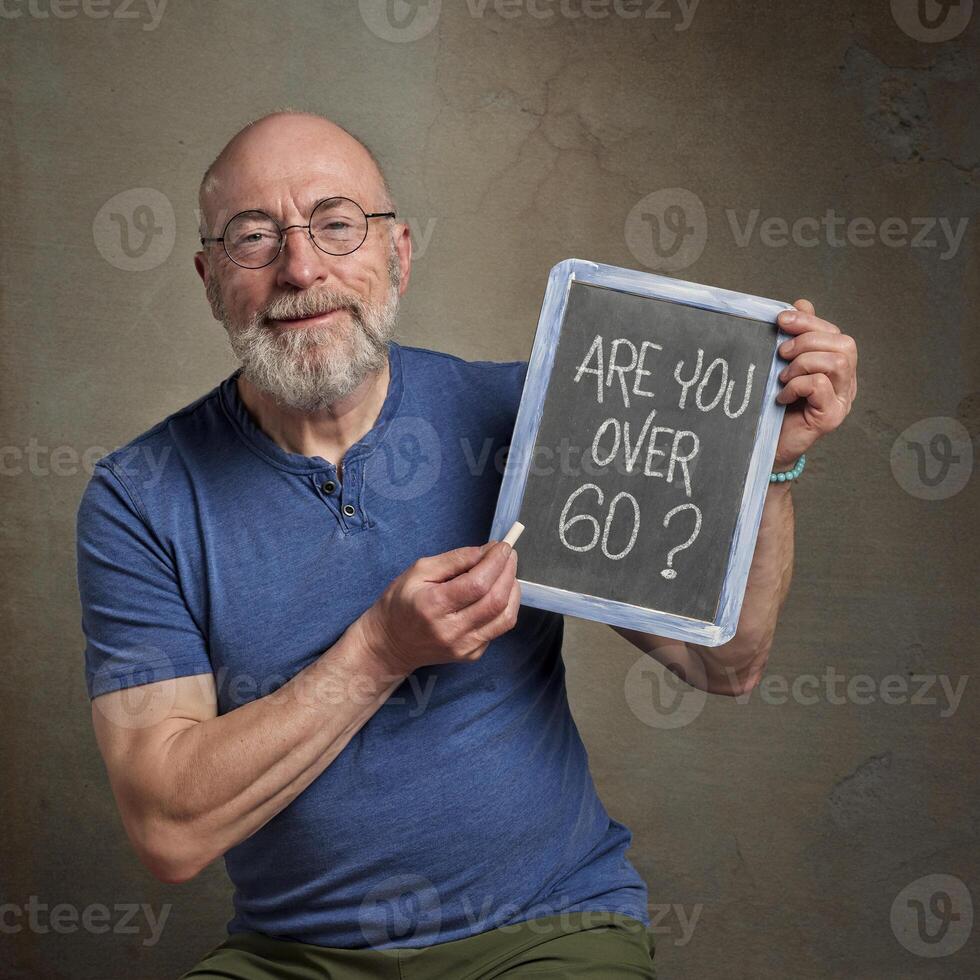 Are you over 60. A question on a blackboard. photo