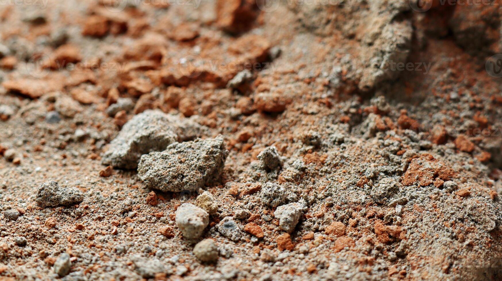 Concrete wall with lining from bits of broken brick. Used as a background. destroyed wall photo