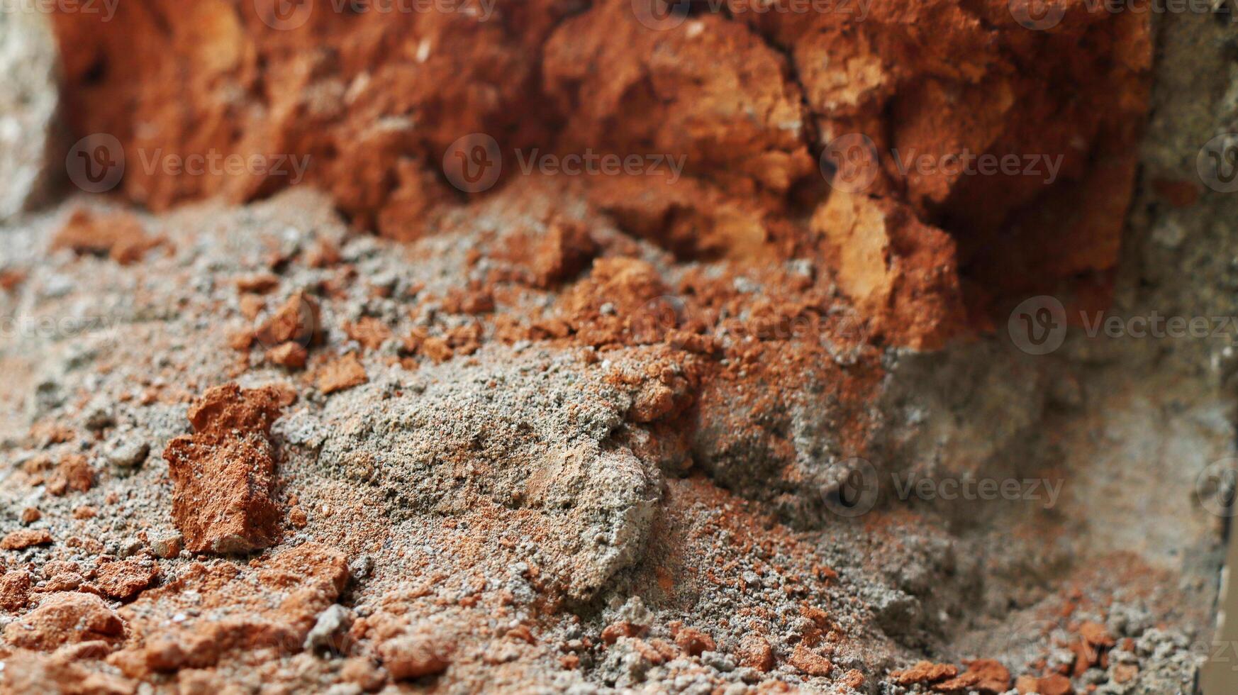 destroyed wall with lining from bits of broken brick. Used as a background. photo