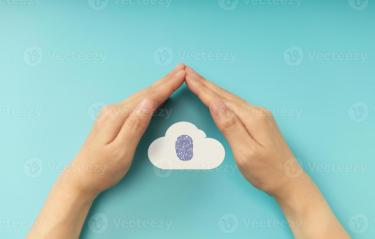 Hands shielding Fingerprint on Cloud symbol, representing Cybersecurity, data privacy, and online protection. Top View photo