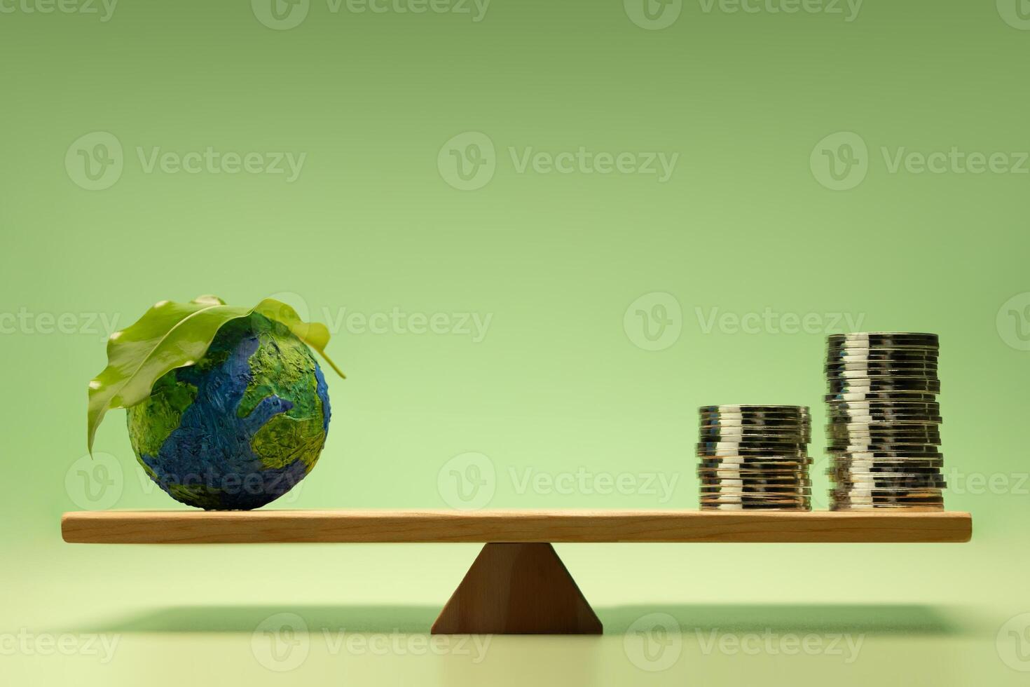 Sustainable, Green investment, green finance, and eco-friendly economic growth. Coin money Stack and Green Leaf Globe balanced on a scale photo