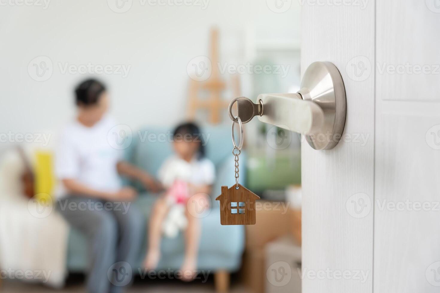Open the door found Family smile and play on new house, inside the room was a cardboard box contain personal belongings and furniture. move in the new apartment or home. photo