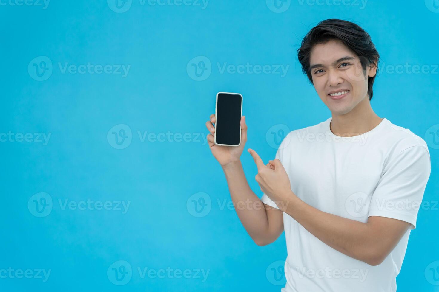 Asian handsome man exited surprise face expression . Male point with the phone. exciting smile and happy adorable rejoices. Very enjoy and fun relax time. wow, girl holding smartphone. photo