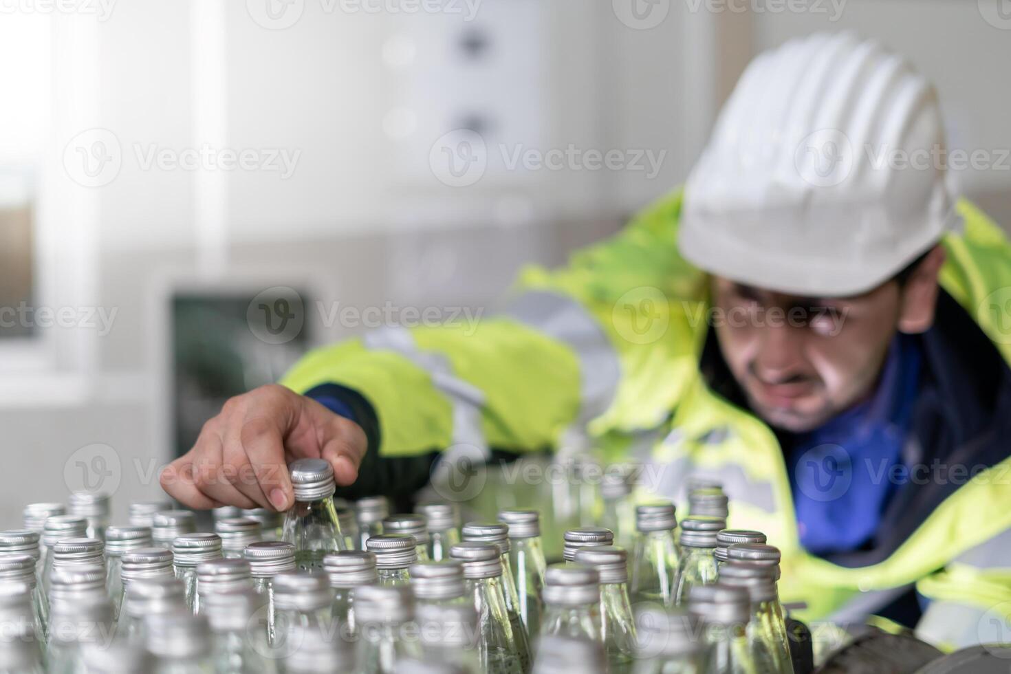 Factory of food or beverages, engineer check Conveyor for feed bottle, food or beverages on warehouse before send product to the customer. Quality control or assurance, Good standard photo