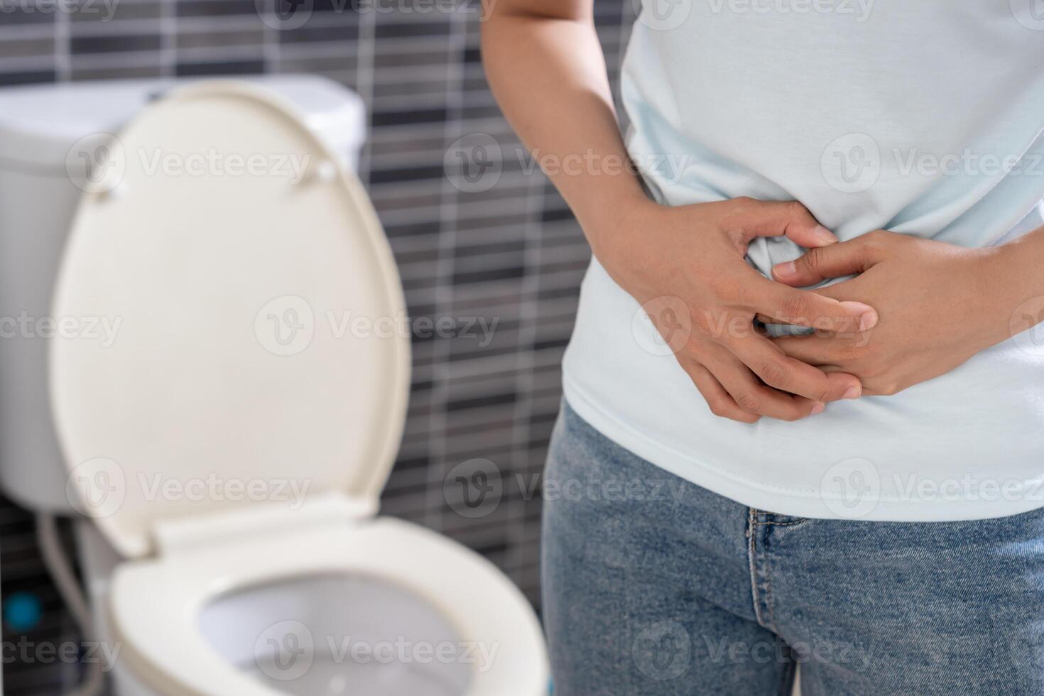 Constipation and diarrhea in bathroom. Hurt woman touch belly stomach ache painful. colon inflammation problem, toxic food, abdominal pain, abdomen, constipated in toilet, stomachache photo