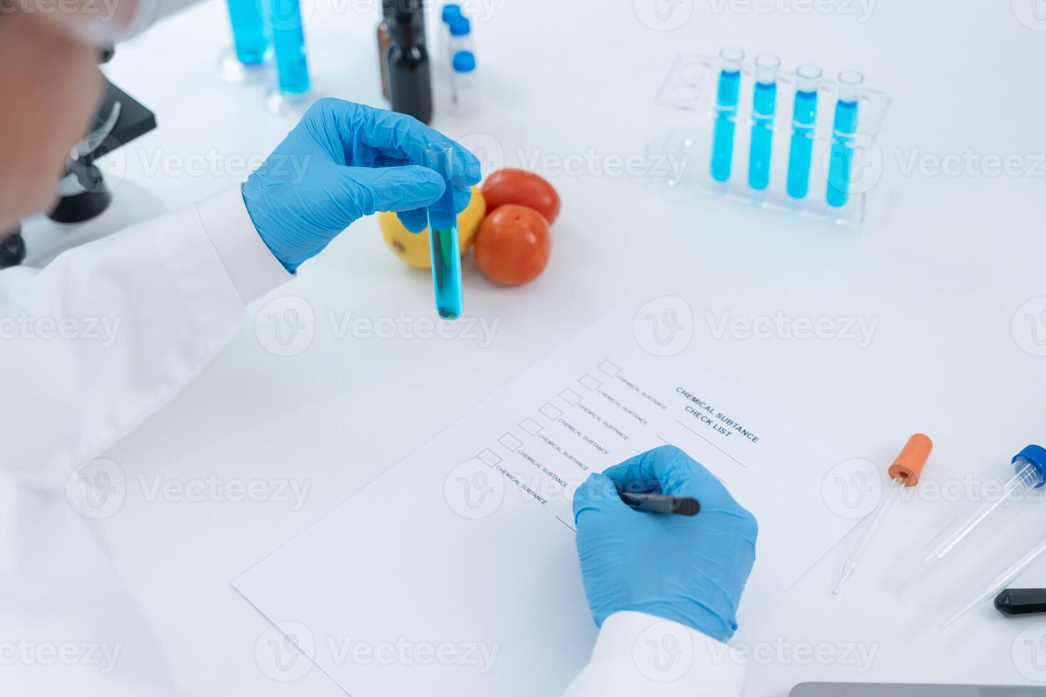 Scientist check chemical fruit residues in laboratory. Control experts inspect the concentration of chemical residues. hazards, standard, find prohibited substances, Microbiologist photo