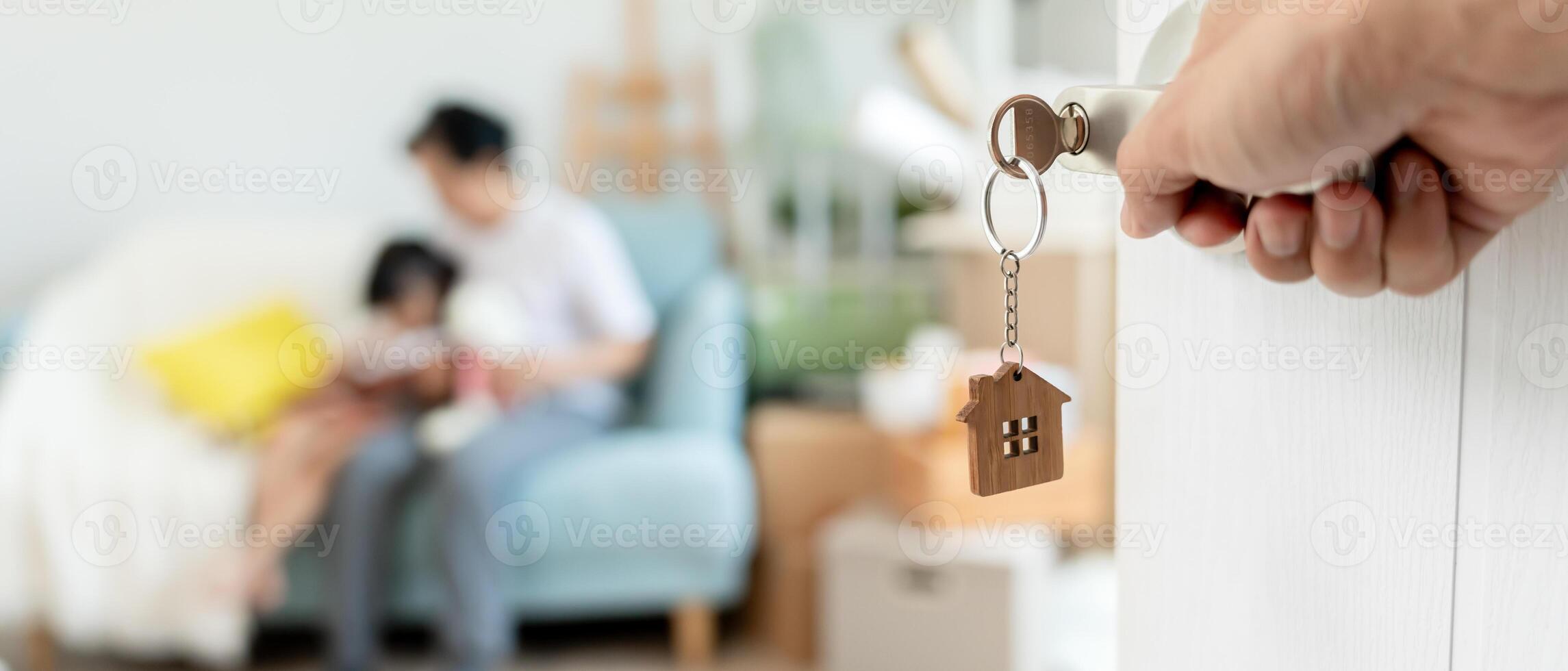 Moving house and relocation. Open the door found Family smile and play on new house, inside the room was a cardboard box contain personal belongings and furniture. move in the new apartment or home. photo