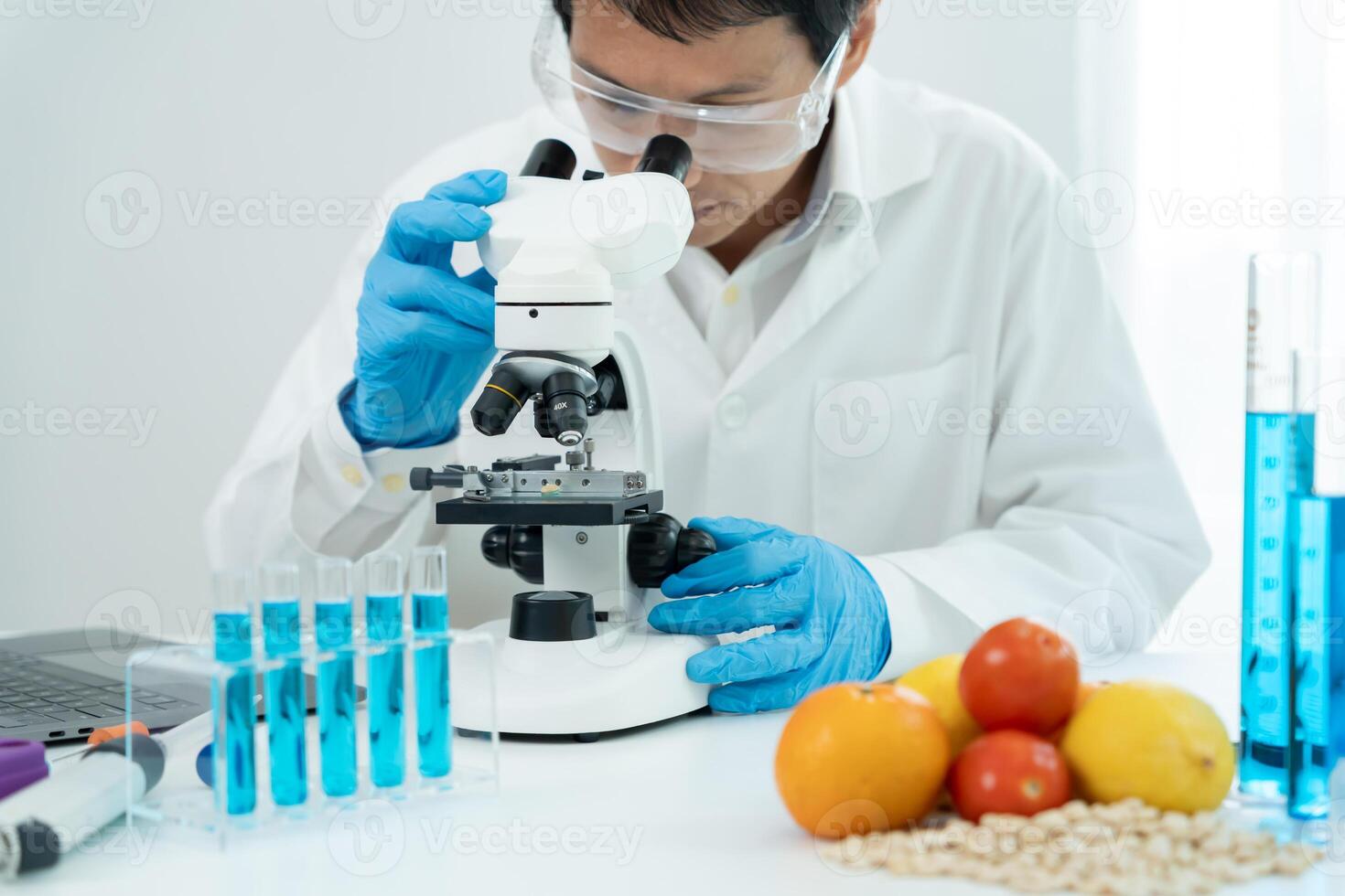 Scientist check chemical food residues in laboratory. Control experts inspect quality of fruits, vegetables. lab, hazards, ROHs, find prohibited substances, contaminate, Microscope, photo