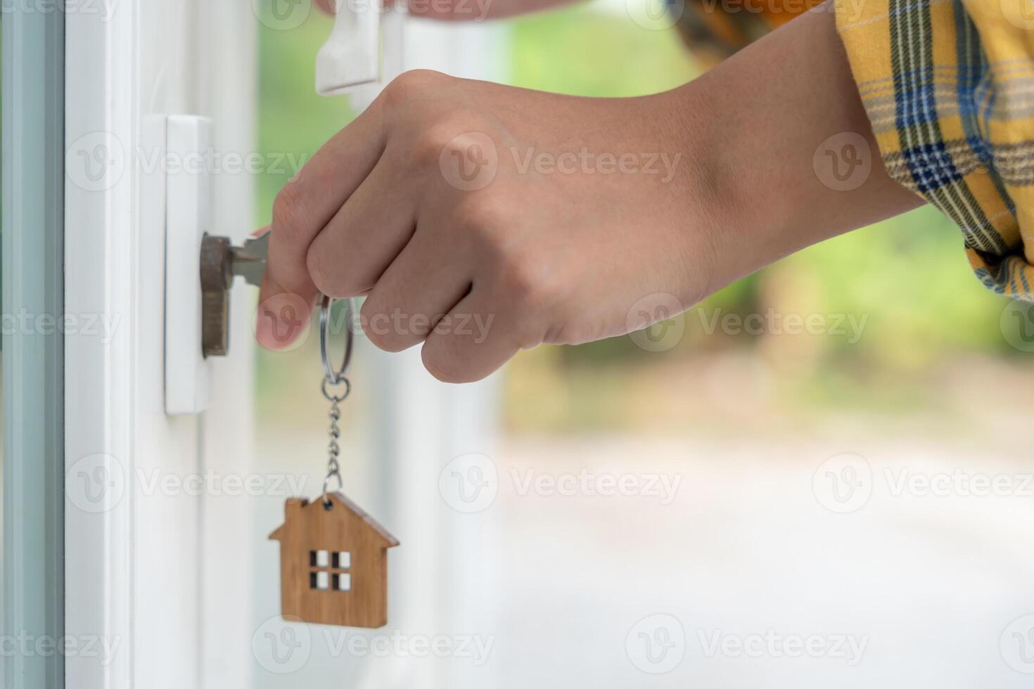 Landlord key for unlock house is plugged into the door. Second hand house for rent and sale. Owner use hand unlock door mortgage for new home, buy, sell, renovate, investment, owner photo