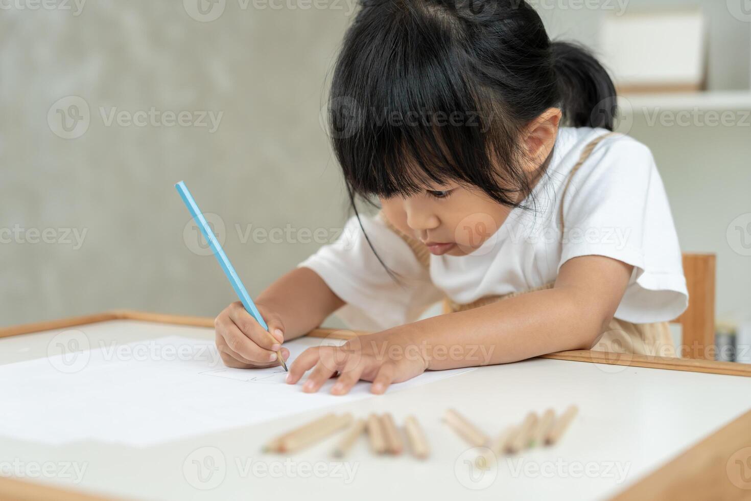 Happy Asian children learning and enjoy paint. family is happy and excited in the house. Mother and daughter having fun spending time together. Holiday, Activity, Executive Function, IQ, EQ photo