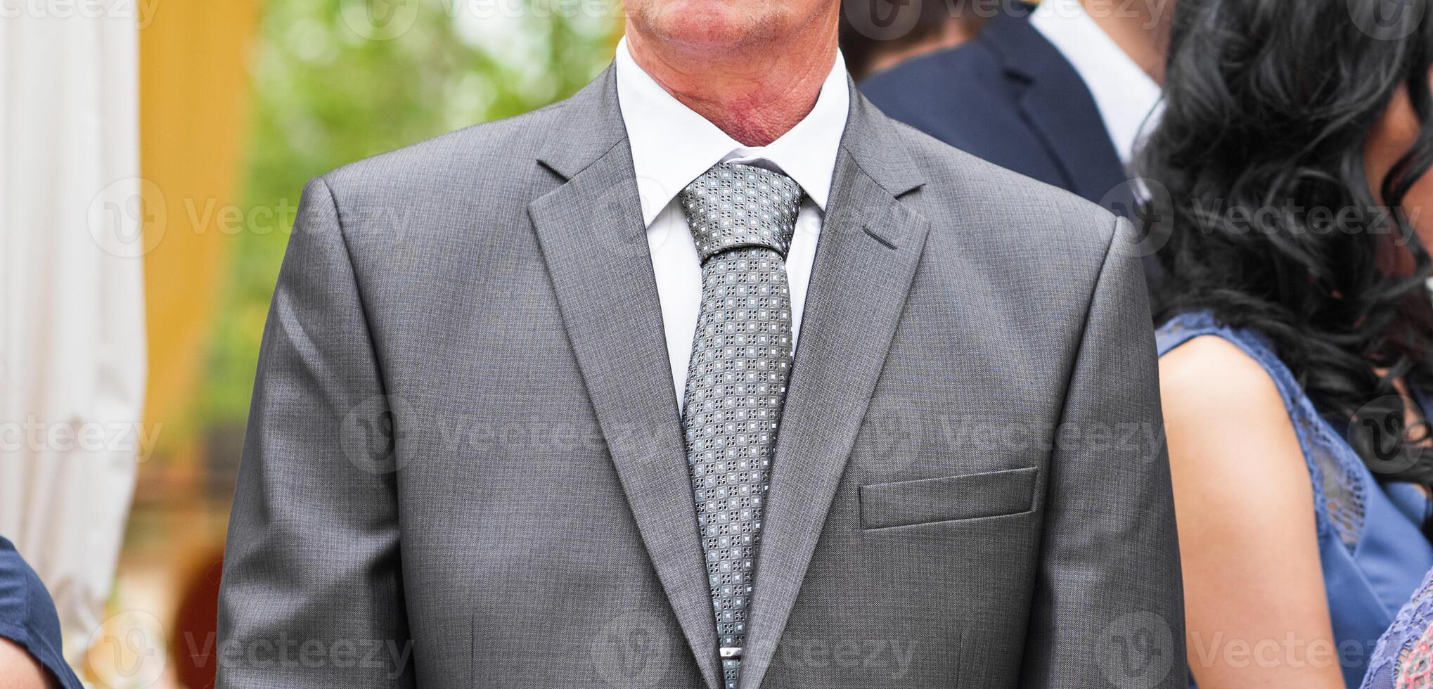 confident mature businessman standing outdoors photo