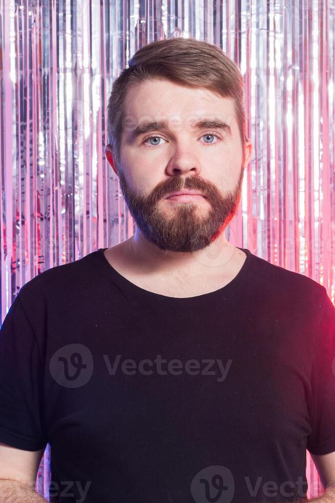 Sad man against shiny background. photo