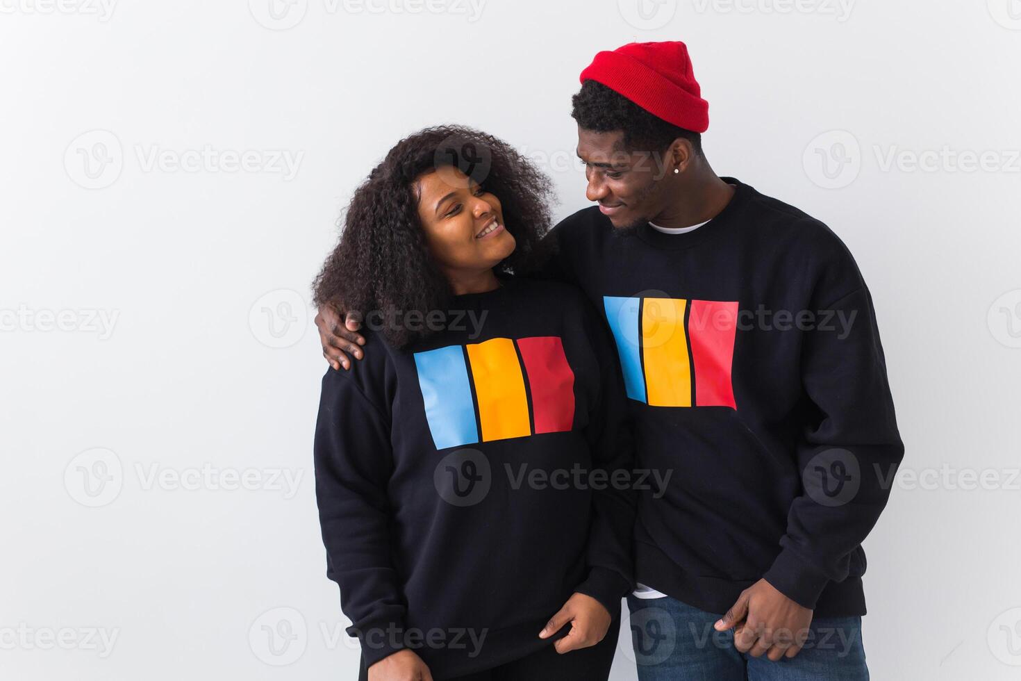 Happy African American woman and man have relationships, toothy smile, happy to meet with friends, dressed casually on white background. Emotions and friendship. photo