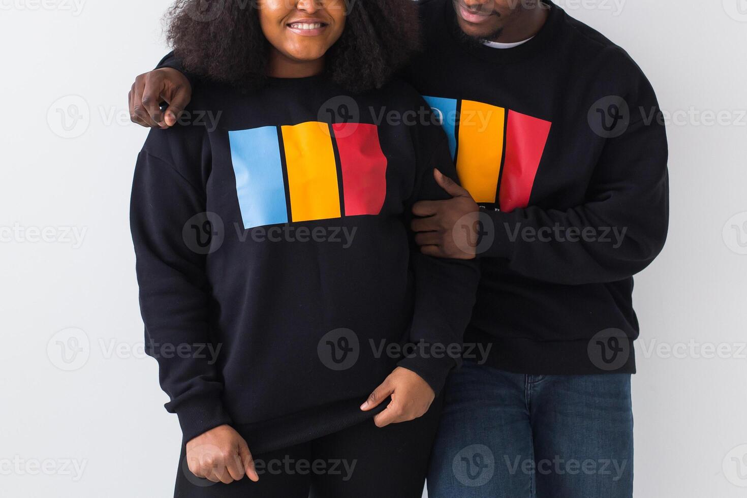 Close-up of African American woman and man have relationships, toothy smile, happy to meet with friends, dressed casually on white background. Emotions and friendship concept. photo
