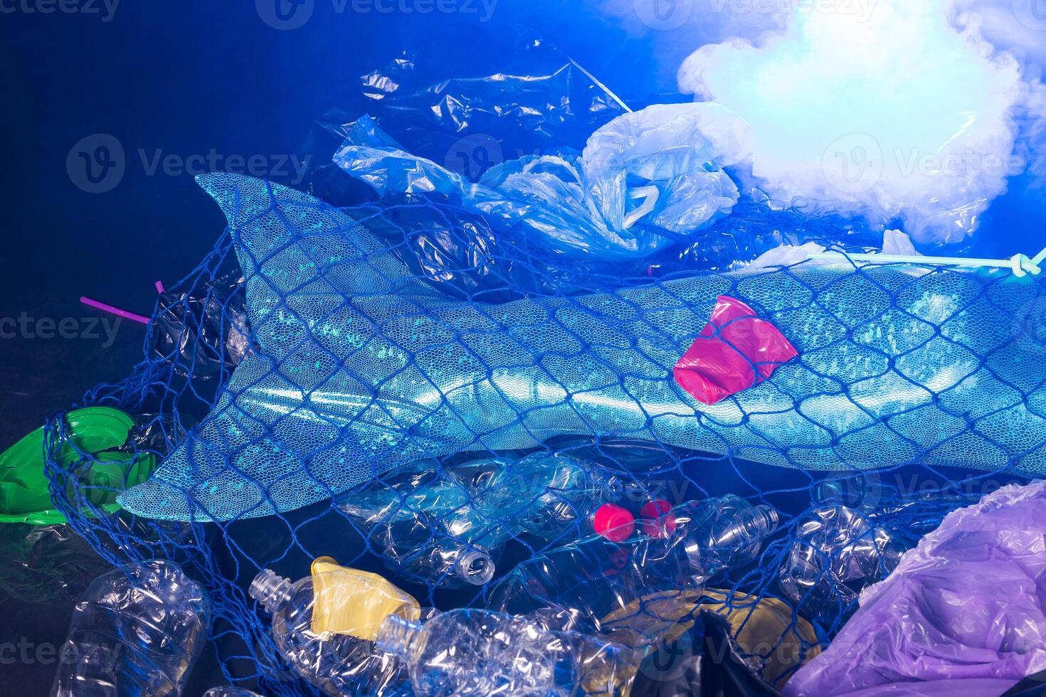 Sea plastic pollution concept. Mermaid in the ocean. Plastic is everywhere. Environmental protection. Close-up. photo