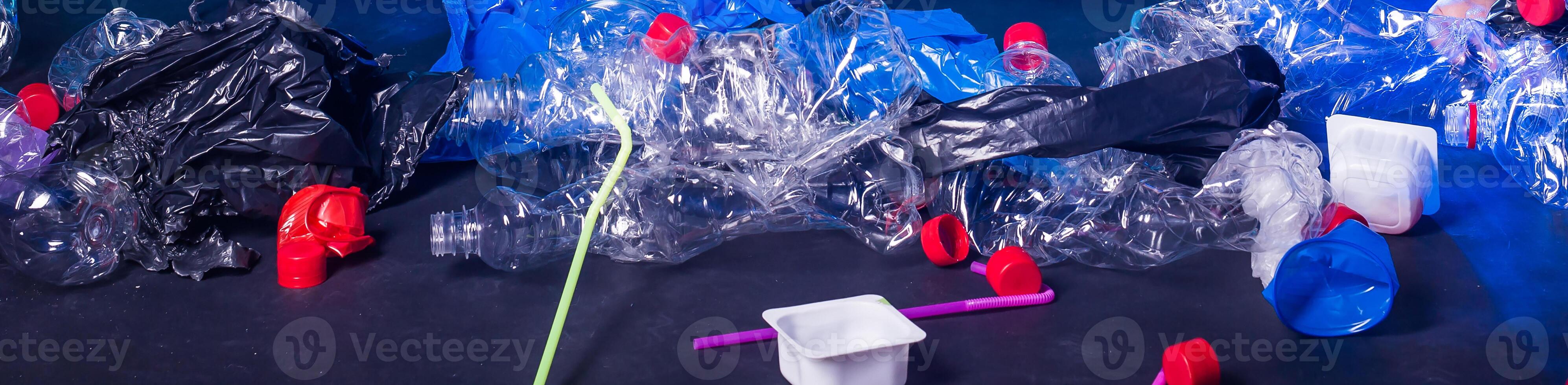 Recyclable garbage of glass and plastic bottles. Pollution and environmental concept. photo