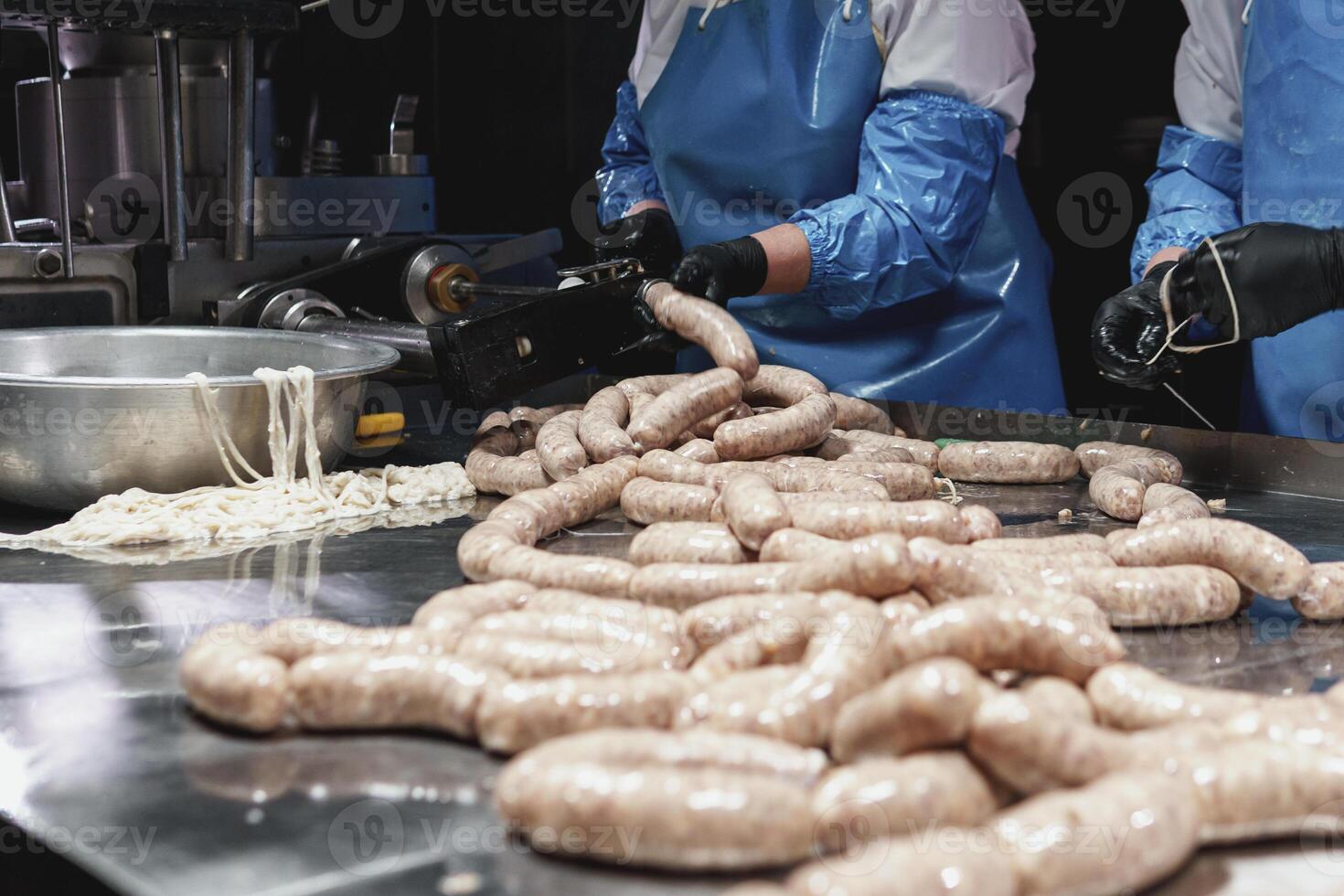 Grill sausages production process at the meat factory. photo