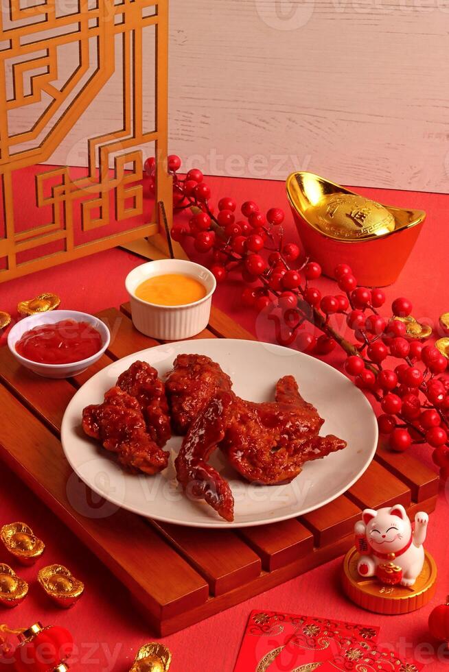 a plate of food on a table with a chinese lantern photo