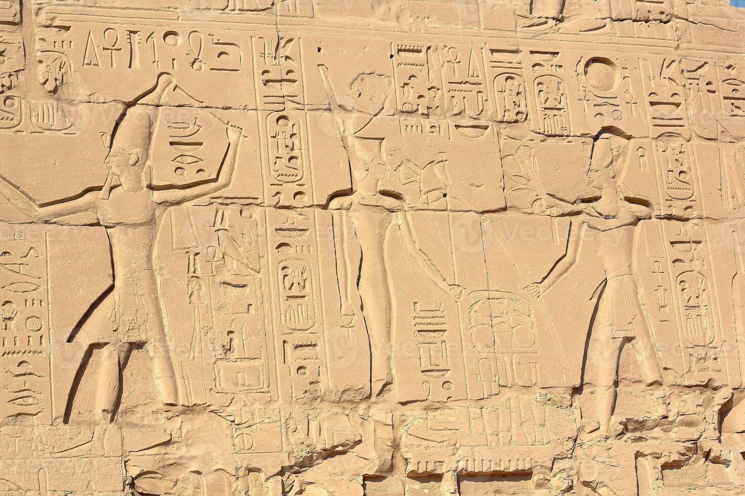 Ancient egyptian hieroglyphs on the wall of karnak temple in Luxor, Egypt. photo