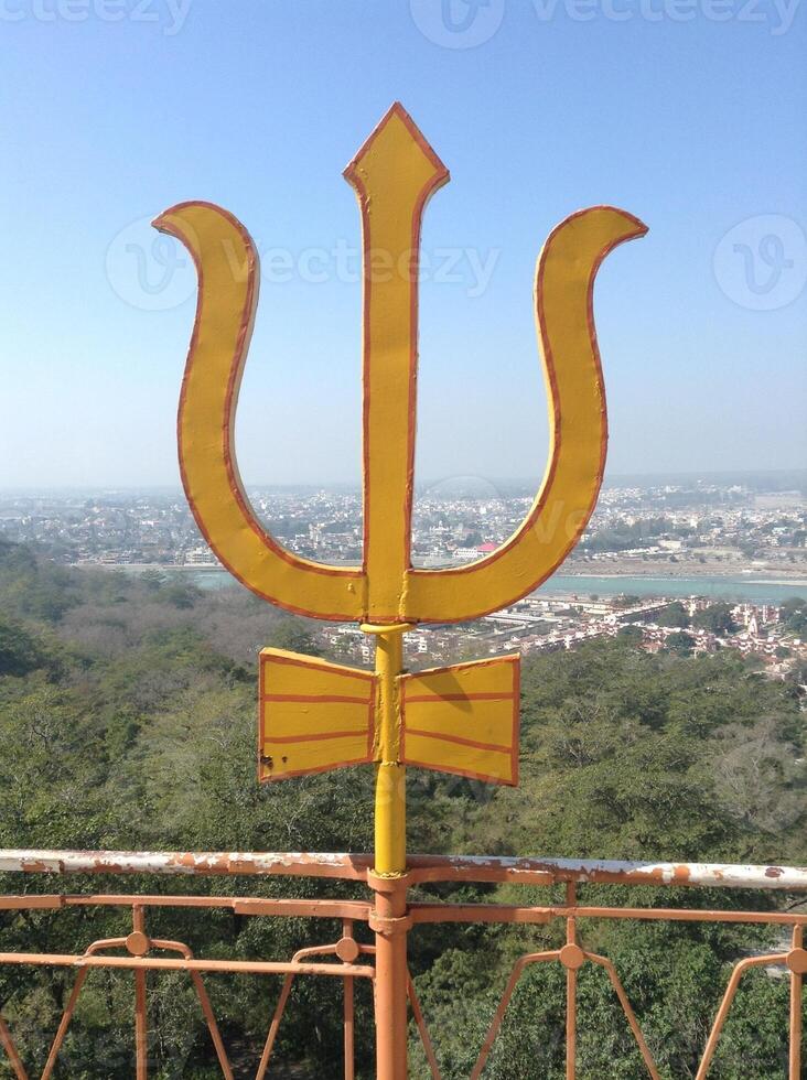 Trident or Trishula of Shiva at hindu temple in Rishikesh, India. photo
