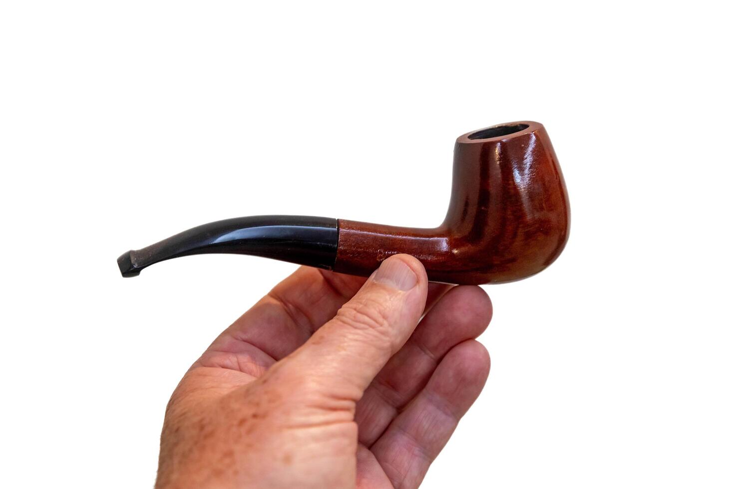 Hand holding luxurious pipe in selective focus and smooth background 4711 photo