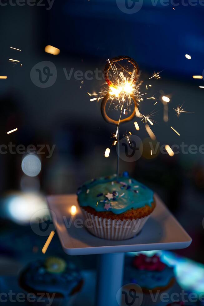 Cupcake with Sparkler in Shape of Number Eight 8 photo