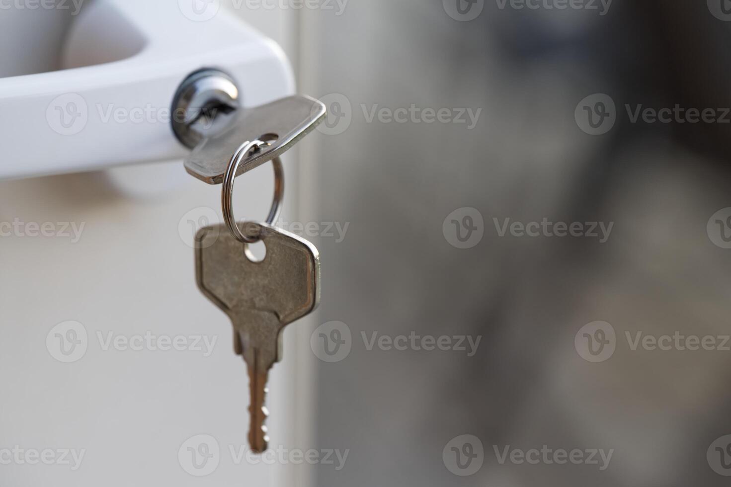 Key Inserted in Door Lock Close-Up photo