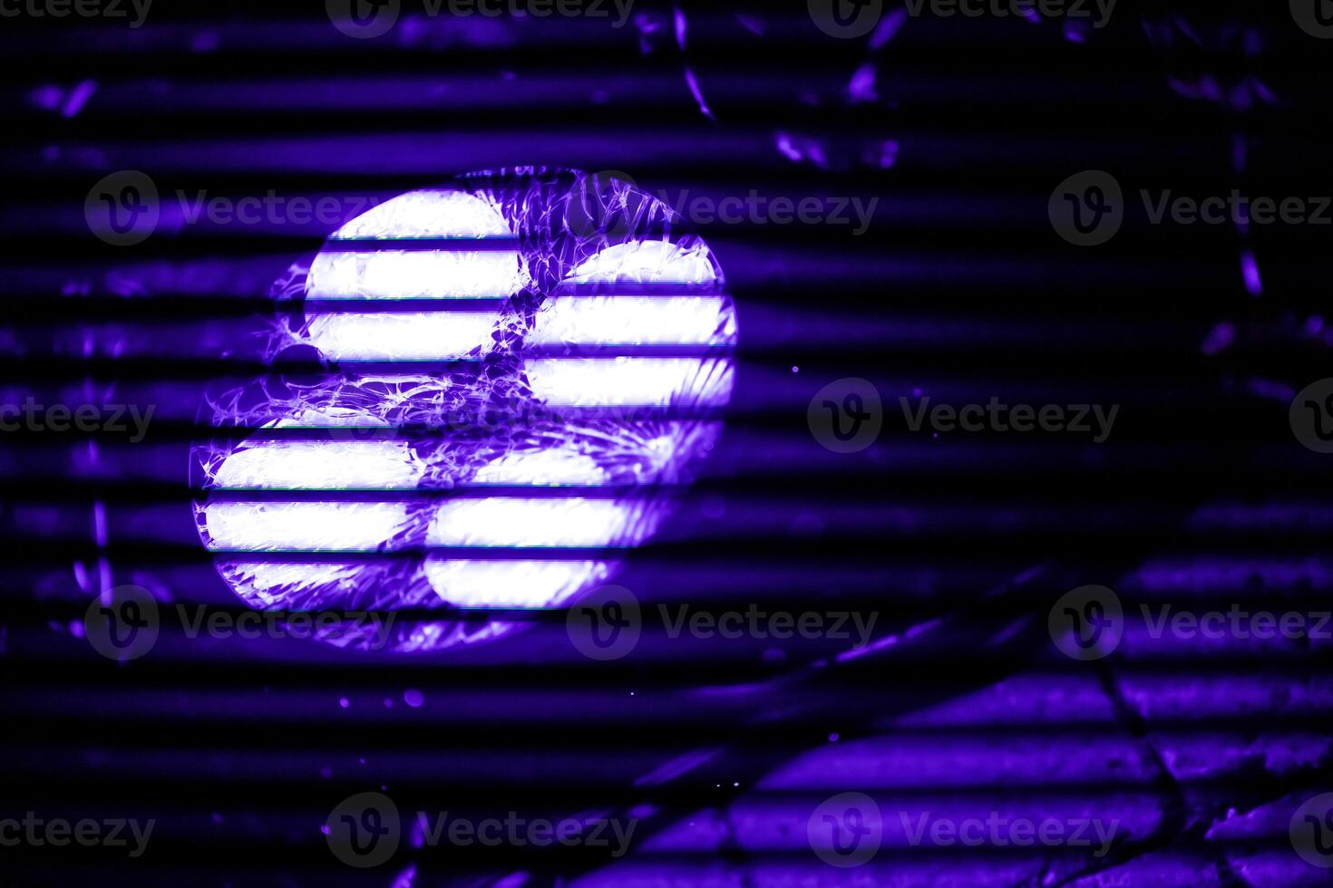 A close-up view of a four LED Spot, illuminated ultraviolet light at 50Hz creating a striking purple flicker effect photo