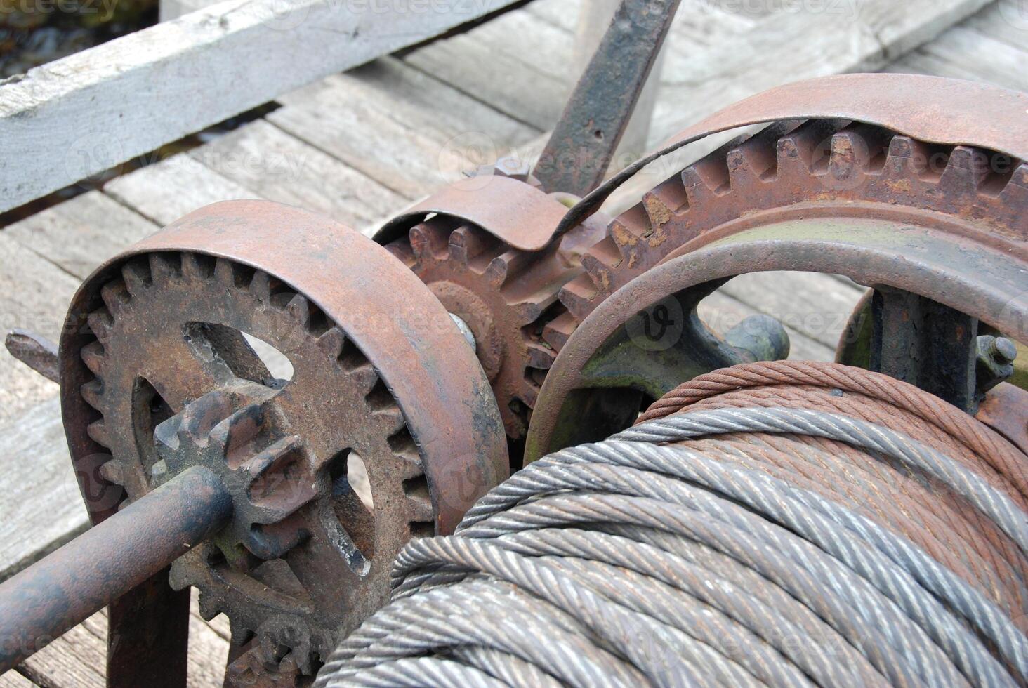 Rusty Mechanical Winch with Gears and Cable photo