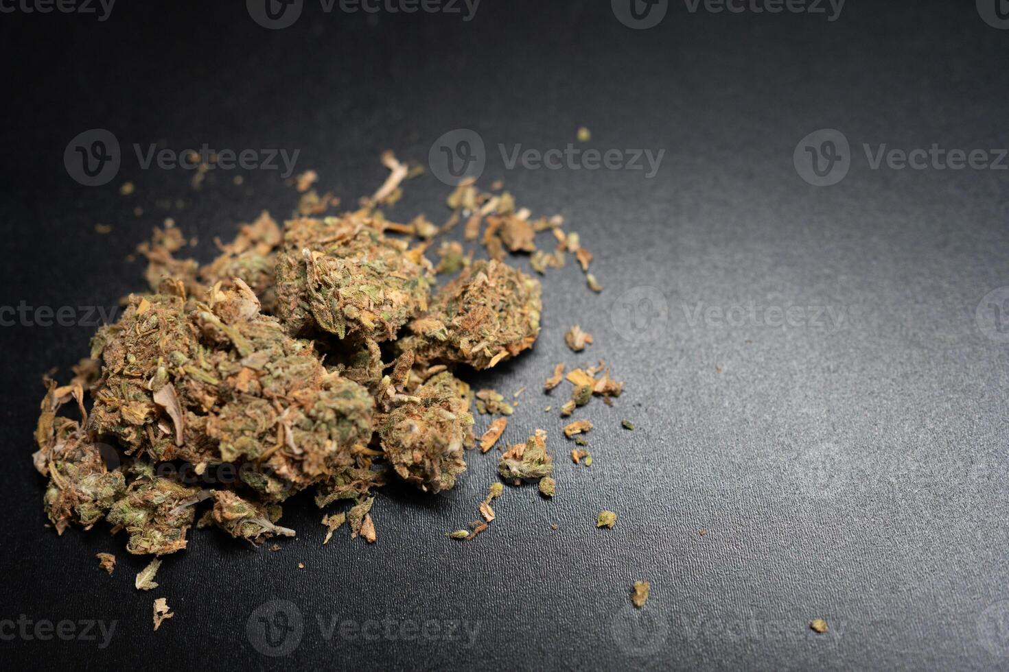 Marijuana Displayed on a Dark Surface With Details Visible photo