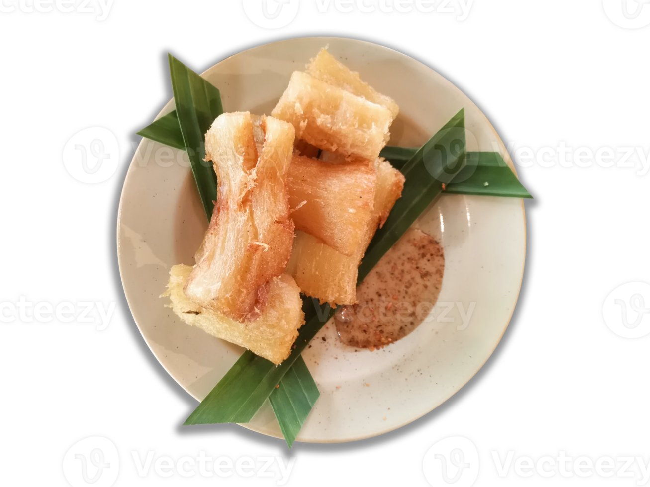 Singkong goreng or fried cassava is a traditional Indonesian food. Served on a white plate decorated with banana leaves. Eaten with sesame peanut sauce.Top view. png