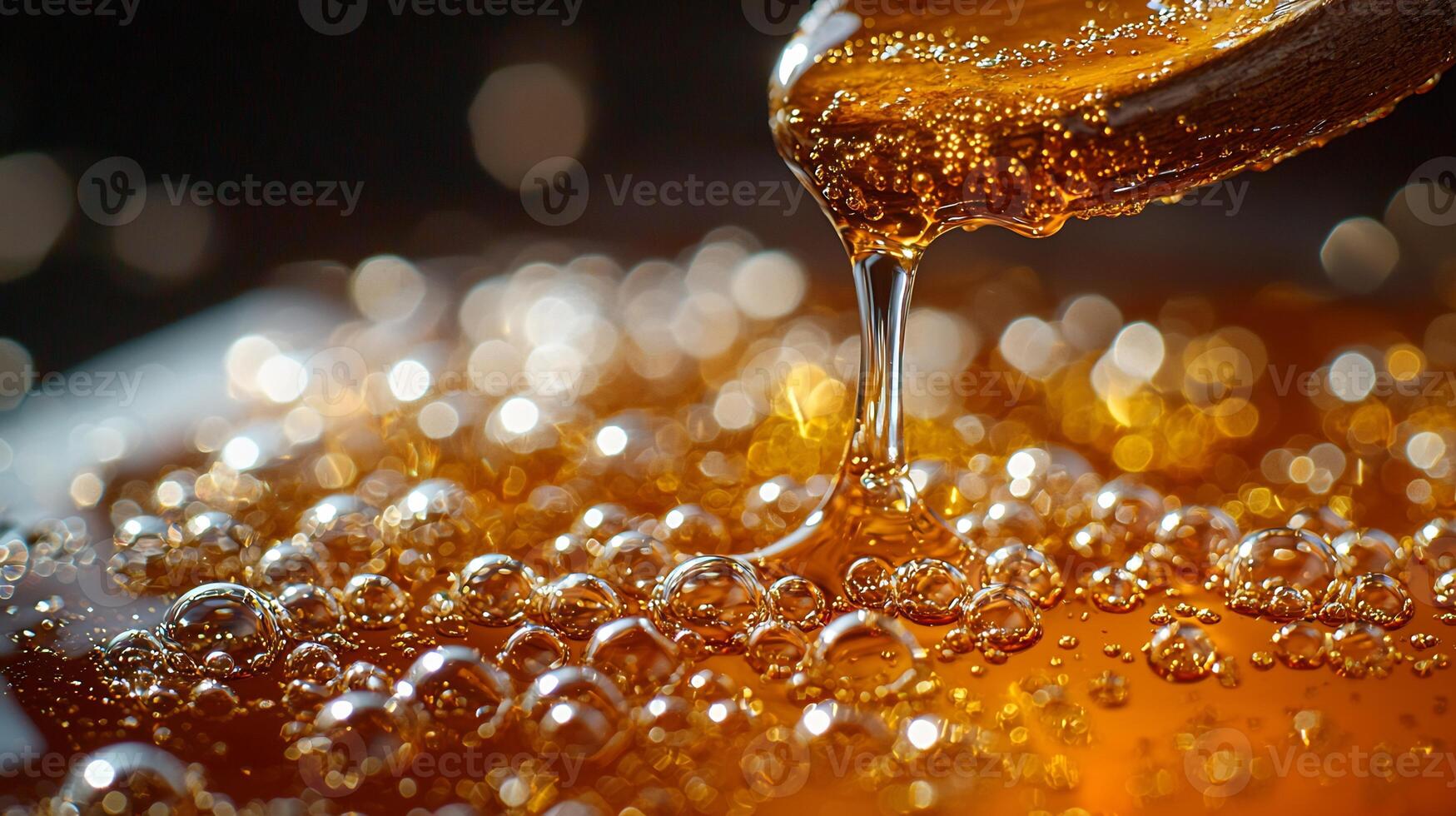 Macro image of artisanal syrup directional lighting emphasizing jewel toned viscosity bubbles suspended thick liquid rustic spoon dripping syrup photo