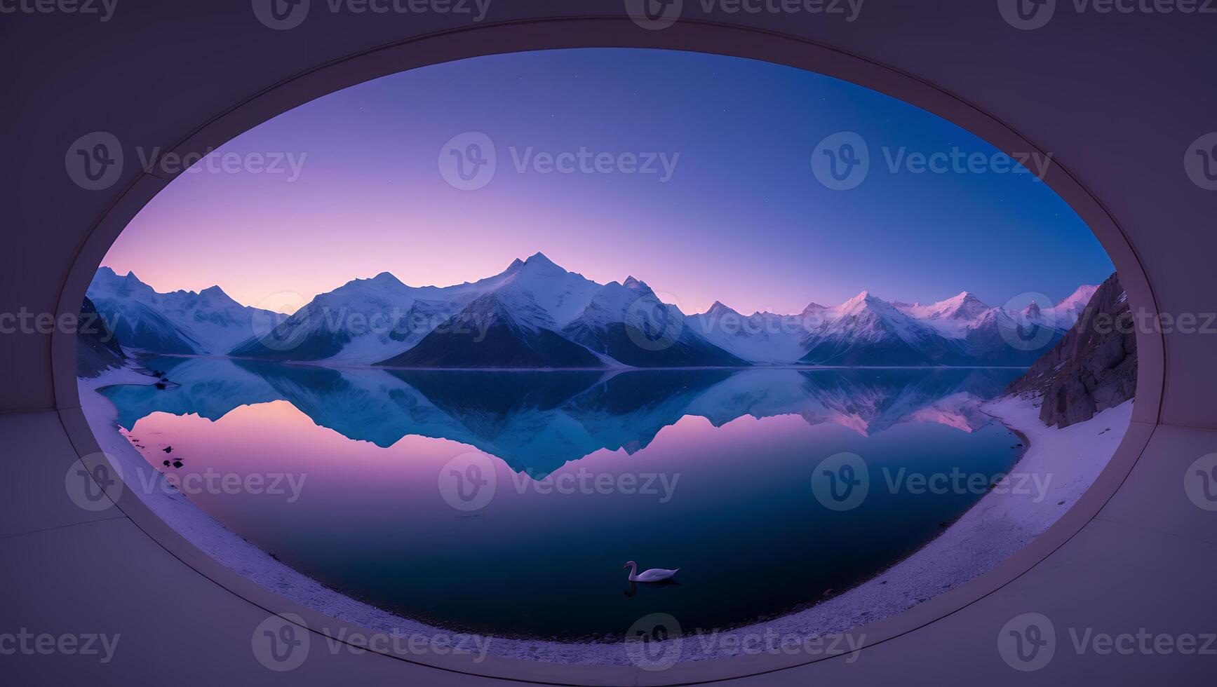 Snowy Mountains Reflected in Calm Lake Viewed Through Round Window photo