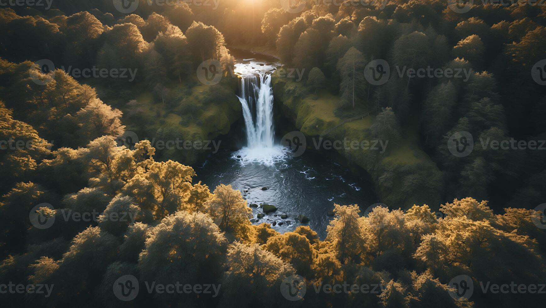 Waterfall Flowing Through Forest Captured From Above at Sunset photo