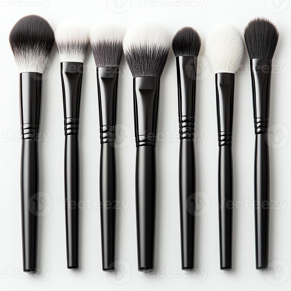 A set of professional makeup brushes arranged in a row, showcasing different brush sizes and shapes for various applications. photo