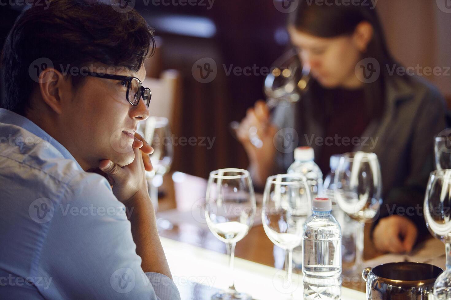 Attentive Sommelier Studying During Wine Tasting Session at Educational Workshop photo