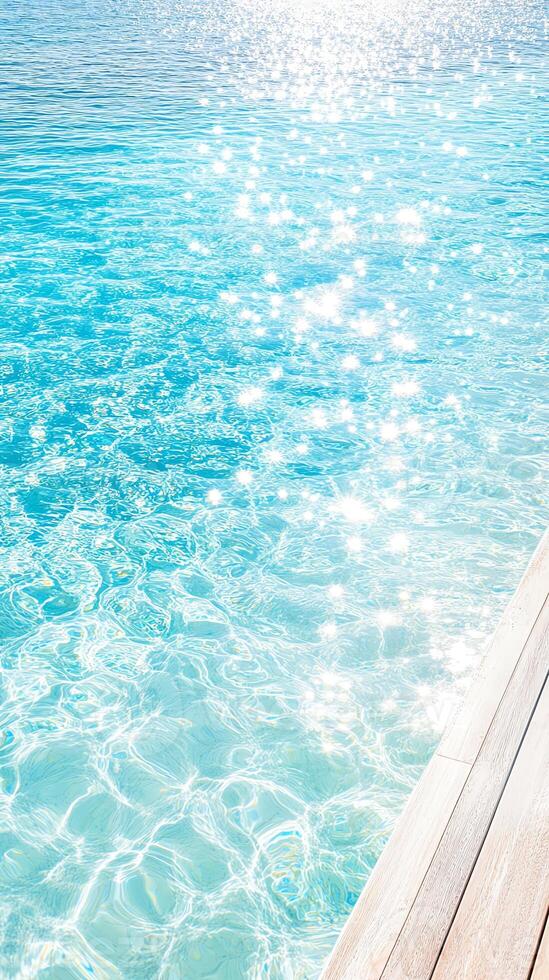 A tranquil view of sparkling blue water, reflecting sunlight, perfect for relaxation and nature appreciation. photo
